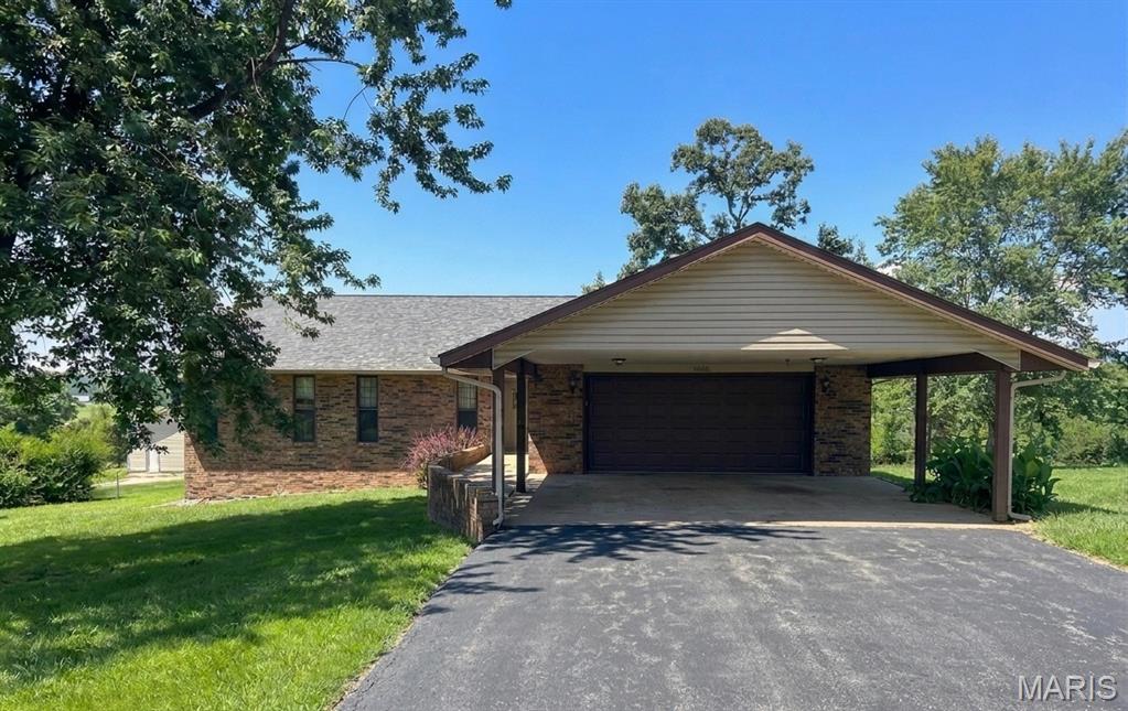 CHARISMATIC CHRISTOPHER DRIVE! Enjoy the best of country living just minutes from Rolla! This 3 bedroom, 2 bath home sits on 5+/- beautiful acres and features an attached 2 car garage and carport, a spacious 26x30 shop building with lean-to, gazebo area perfect for entertaining, and a swing set for family fun! This open floor plan blends together the kitchen, dining room and family room to create the true heart of this home! The shop and acreage will give you the opportunity for the small hobby farm of your dreams!