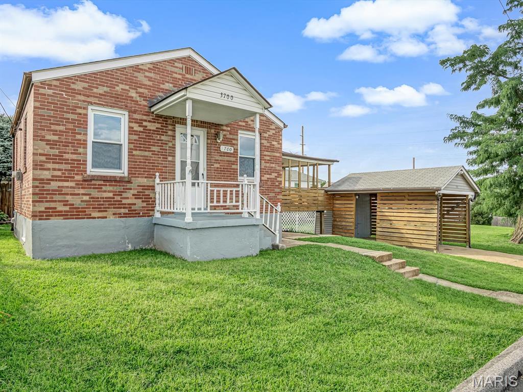 Looking for simple, low-maintenance living? This full brick bungalow could be just what you've been searching for! Offering 1 bedroom, 1 bathroom, a cozy living room, and a functional kitchen, this home is the perfect size for someone looking to downsize, purchase their first home, or add a great investment property to their portfolio.

The bright sunroom provides extra living space and is the perfect spot to enjoy your morning coffee, read a book, or unwind at the end of the day. Step outside to the covered back deck overlooking the backyard, giving you another place to relax and enjoy the outdoors.

The unfinished walk-out basement offers plenty of storage. Outside, you'll also find a one-car carport and a storage shed for your tools and lawn equipment.

Cute, quaint, and easy to maintain, this home is full of potential and ready for its next owner!