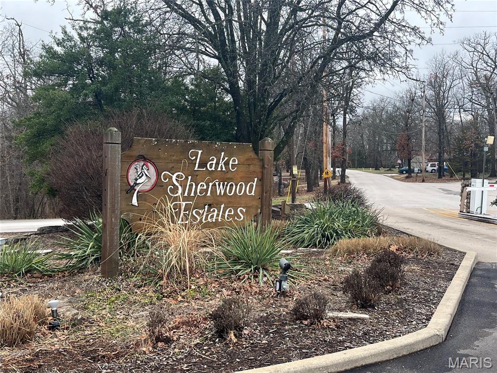 Welcome to Lake Sherwood Estates! A beautiful and very buildable lot, with a very gentle slope for a possible walkout. You'll love this beautiful gated community and all that it offers for a secluded lake-life. Nature, private security, lakes, a beach, a pool, ball diamond, parks, trails, wildlife, activites (4th of July fireworks, Memorial Day/Labor Day, Chili Cook-off, Bands on the beach!, Christmas/Valentine's Day/New Year's Celebrations and more! Whether your just enjoying the amenities, social events, or looking for a great place to build your future forever home, Lake Sherwood has so much to offer and the price is so right! Show at will but all showings must be accompanied by an agent.
