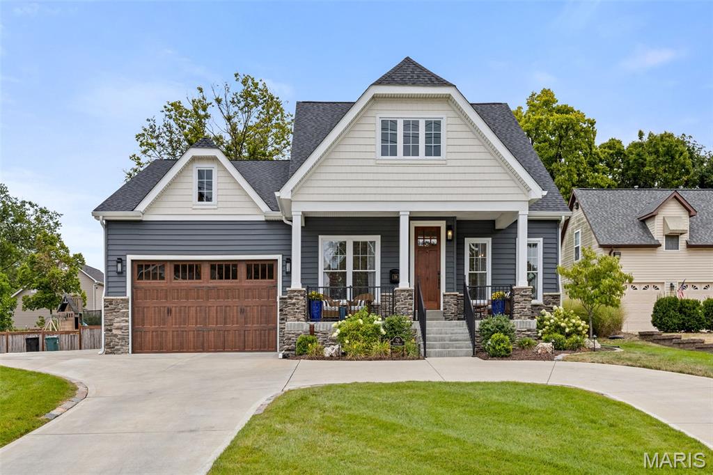 This is the crown jewel....it is the Builder's own home! Pull into the circular driveway - 9'-1st floor is entirely hardwood floors. Dining Rm w/wainscoting & crown molding leads to light-filled Butlers Pantry w/quartz c-tops, custom cabs + Bev ctr. Family Rm & Gourmet Kitchen have Box beam ceiling, upgraded quartz c-tops, & stone base gas fireplace. White custom cabinetry w/brushed brass lighting  & cabinet pulls highlight the Farm sink, Coffee bar ,Thermador SS pkg w/built in refrigerator & freezer. Hartman custom-built Navy Blue Island w/ 4-5 seats. Off the Kitchen is a Vaulted Sunroom w/painted ship lap & stained ridge beam - opening to a Covered Porch(w/ heater ,fan, TV ) & expansive deep backyard ready for parties or a pool.1st floor Primary suite is vaulted w/ridge beam; His & Hers closets by STL closet & a luxury Bath complete w/heated floor & custom tile accent in Shower w/ 3 shower heads. The 2nd main flr bedrm is currently an Office w/full bath & a spacious WIC w/ desk. Mudroom w/5 cubbies is tucked away behind the Kitchen & is the access to the oversized 2 car attached Garage + the 1st floor Laundry Rm w/slop sink. Bedrooms 3 & 4 are 9'-2nd floor ensuites w/every detail checked from STL Closet WIC's to cabinet toe kick heaters. 9'-LL is an Entertainer's dream w/Family Rm w/Bar, Game Rm, & Craft Rm.For the Fitness buff there is a HUGE Gym & miles of shelving for storage in the unfinished. The finishes & extras are too numerous to list!!This is a RARE chance; HURRY!
