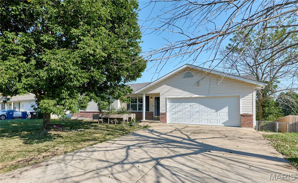 NO HOA, a finished basement, and a large fenced backyard- all in the heart of Troy!  This 3 bedroom , 2 bathroom house checks all the boxes with an open concept layout that makes everyday living and entertaining a breeze.  Step inside to a bright, open-concept floor plan featuring a large living room. The spacious kitchen, refrigerator stays, flows seamlessly into the living area and features a center island with plenty of room for gathering, meal prep, and casual dining. The primary bedroom offers it's own private ensuite bath, creating a comfortable retreat. Two additional bedrooms and full hall bath provide plenty of flexibility for family or guests.  The main floor laundry adds everyday convenience.  Head downstairs to the finished basement that is perfect for a rec room, home office, or gym.  Outside you will find a large fenced backyard with a deck that is perfect for grilling or drinking your morning coffee. The 2 car attached garage provides plenty of parking and space for storage.  Great space, a fantastic location and NO HOA- this one is ready to welcome you home.