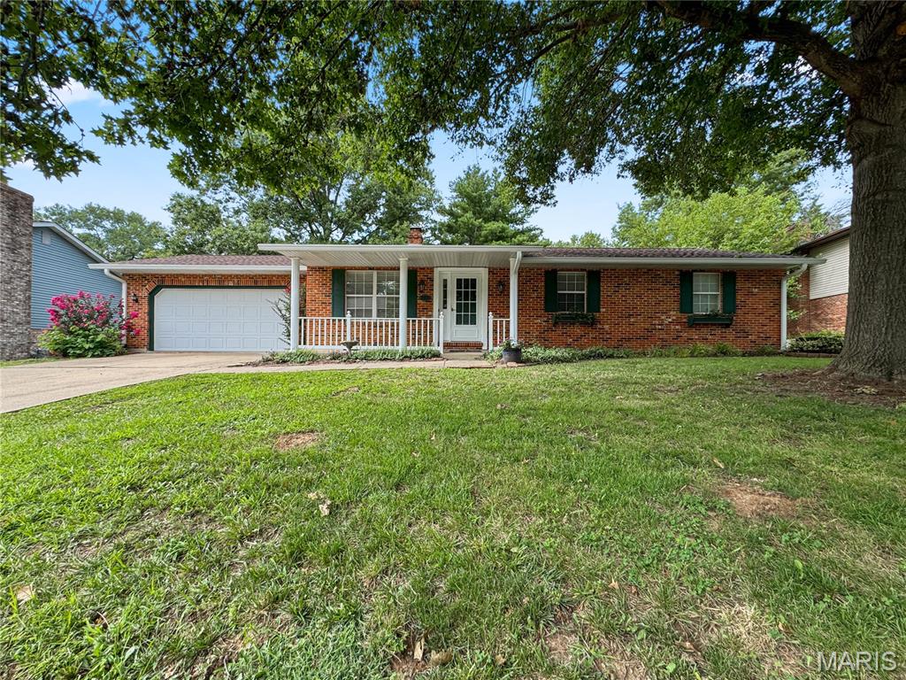 Spacious updated ALL BRICK ranch with a WALKOUT basement on an adorable street in desirable Sunset Terrace subdivision of Smithton! Offering over 2,250+ finished square feet, this 2 bed, 1 bath home combines comfortable living with incredible entertaining space! The main level features a bright and inviting living room with LVP flooring that flows into the dining area and updated kitchen. White cabinetry, plenty of counter space, stainless steel appliances, breakfast bar seating, and French doors leading to the elevated deck make this kitchen both functional and welcoming. The primary bed includes its own private bath and walk in closet, while two additional bedrooms and a full hall bath complete the main level. This home has fresh paint and new carpet, is move in ready and can accommodate a fast closing!   Downstairs, you'll find a large family room centered around a stunning floor to ceiling brick fireplace, plus a custom bar area that's ready for game days, holidays, and gatherings with family and friends. A half bath, multiple storage rooms including worksshop and a walk out lower level for added convenience and flexibility. Step outside to enjoy the covered patio beneath the deck, mature shade trees, retaining walls, and a backyard that backs to woods on an extra large lot for added privacy. Additional features include an attached two car garage, public utilities, and a fantastic location within the Smithton Schools and Freeburg High and just minutes from Belleville and the Metro East!  New Roof and Gutters 2026 with a transferable warranty, New HVAC July 2025 (American Standard 2 Ton Heat Pump), New Water Heater 2025.