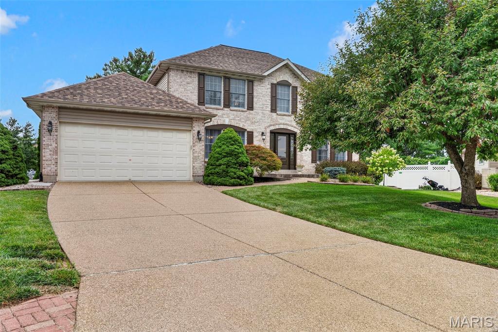 Welcome to 307 Camilla Drive, a stately two-story home featuring a full brick front, beautiful landscaping, and a peaceful cul-de-sac setting in North O’Fallon. Proudly offered by its original owner, this lovingly maintained home reflects years of thoughtful care and pride of ownership. Step inside to a spacious main level filled with natural light, including a welcoming family room with a gorgeous gas fireplace that creates the perfect gathering space. The chef’s kitchen offers updated appliances, a center island, pantry, abundant cabinetry, and under-cabinet lighting, making both everyday meals and entertaining a breeze. The main floor also features an elegant dining room, separate living room, and a generously sized laundry room complete with a convenient built-in cubby area. Upstairs, the impressive owner’s suite offers plenty of room to unwind with a large walk-in closet and luxurious private bath featuring a beautiful tiled shower and oversized soaking tub. Three additional spacious bedrooms and a second full bathroom provide plenty of room for family, guests, or a home office. Step outside and discover a backyard retreat designed for relaxing and entertaining. The expansive aggregate patio is surrounded by mature trees and beautifully maintained landscaping, creating a private outdoor oasis. The unfinished basement is already roughed in and ready for your vision, offering an opportunity to add even more living space and value. A large two-car garage provides plenty of room for vehicles, storage, and more. Beautifully maintained and ideally situated on a peaceful, beautifully landscaped lot, this North O’Fallon home offers the space, comfort, and setting you’ve been waiting for.