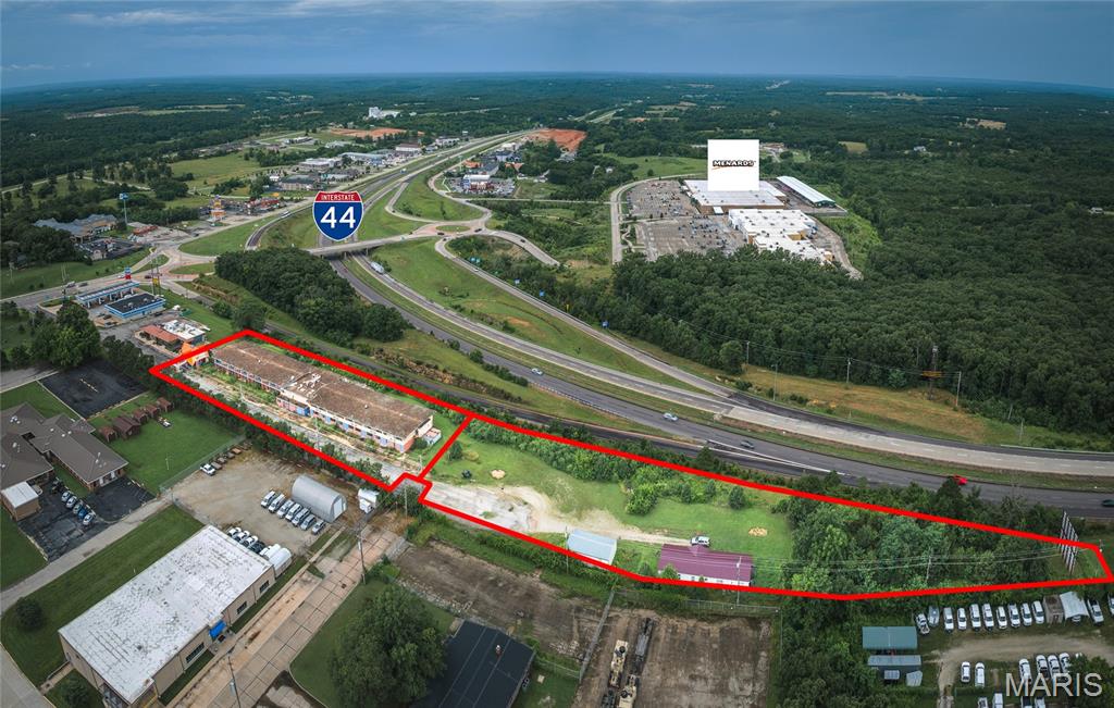 Exceptional I-44 Redevelopment Site – Zoned C-2!  This 3.93 m/l acre property is a standout opportunity for new development in one of Rolla’s most active commercial areas! Zoned C-2 and located just off I-44 at Exit 184, the site offers excellent visibility from the interstate and convenient access for future customers. The former motel on site has been out of use for several years and holds no contributory value—offering a clean slate for your project. Surrounded by restaurants, retail, hotels, and the new Westside Marketplace, this location is ideal for new restaurants, retail centers, motels, or service businesses. The hospital is just a short distance away, and the new VA Clinic is coming soon nearby—further adding to the area's momentum. With continued growth and strong commercial presence, this property is ready for redevelopment.