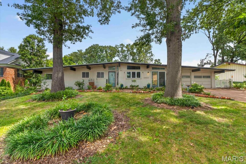 Opportunity awaits in the highly sought-after Harwood Hills subdivision! Nestled on a beautiful, spacious lot, this ranch home offers endless potential for buyers looking to create their dream home. Whether you choose to update and personalize the existing home or take advantage of the exceptional lot to build new, the possibilities are endless in this premier location. Inside, you'll find a spacious layout featuring a kitchen equipped with a gas stove, built-in microwave, dishwasher, and refrigerator. The great room offers a cozy fireplace, while the main level includes three bedrooms and updated bathrooms. The walk-out lower level expands the living space with a large recreation room featuring a second fireplace, three additional bedrooms, and a half bath—providing flexibility for guests, hobbies, or a home office. Outside you will enjoy the expansive, level backyard that backs to mature trees, creating a peaceful and private setting with plenty of room for entertaining, outdoor activities, or future expansion. It's a rare combination of usable yard space and natural privacy in one of the area's most desirable neighborhoods. Additional features include newer windows, 2 car oversized garage and concrete driveway.  Home is being sold as is, presenting a fantastic opportunity to invest and make this property your own.