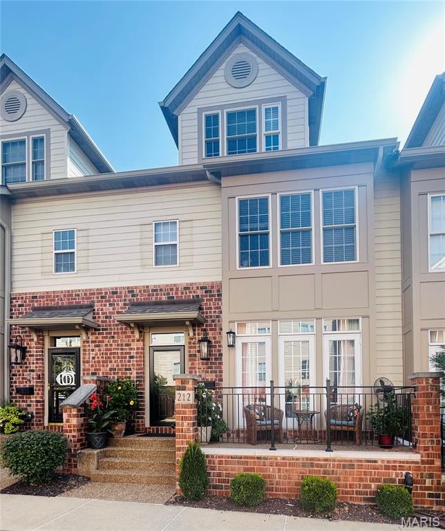 Located in the heart of Kirkwood, these highly desirable Station Plaza townhomes rarely stay available long. Enjoy the convenience of walkability to everything Kirkwood has to offer, including the new Performing Arts Center, shops, restaurants and the Farmers Market
Enter into the bright, open living room featuring a gas fireplace and French doors leading to a charming raised brick patio with decorative railing. The living room flows seamlessly into the dining area and spacious kitchen/family room. The kitchen offers custom cabinetry, solid-surface countertops, a center island with breakfast bar, double ovens(new 2020) and dishwasher(new 2026), along with a cozy nook ideal for casual dining or morning coffee. The open family room provides a comfortable everyday gathering space for relaxing or watching TV and opens to a private deck.
Upstairs, the spacious primary suite offers a walk-in closet and access to its own deck, along with a luxurious primary bath featuring a double-bowl vanity with new countertops, jetted tub and large walk-in shower. The generously sized second bedroom offers comfortable room for a queen-size bed and additional furnishings, a generous closet and its own private en-suite bath.
The expansive third level features a spacious third bedroom with a full bath and a large adjoining family/sitting area. With closets already in place on both sides, the flexible layout could easily be adapted to create a fourth bedroom, or enjoyed as additional living space, a media room or private retreat.
Numerous major improvements have been completed in recent years, offering peace of mind to the next owner. Improvements include 2 HVAC units replaced in 2023, a new front door, storm door and framing in 2025, attic insulation in 2019,  and fresh interior paint in 2025–2026. The HOA has also completed significant exterior improvements, including new roofs, replacement of the majority of the composite siding with Hardie board, and new brickwork and railings on the front porches. With many of the major improvements already completed, this home is ready for its next owner to move in and enjoy.
Come experience this exceptional townhome and all that the heart of Kirkwood has to offer—right outside your door.