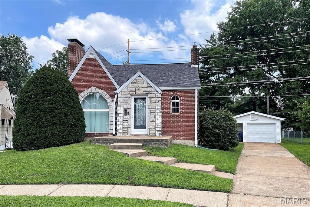LOVINGLY MAINTAINED GINGERBREAD ON A CUL-DE-SAC * THIS 2 BEDROOM 2 FULL BATH HOME IS ADORNED WITH ORIGINAL HARDWOOD FLOORS, DOORS AND TRIM * COVED CEILINGS THROUGHOUT * LIVINGROOM FEATURES WOODBURNING FIREPLACE * RETRO COUNTRY KITCHEN IS HUGE WITH EAT-IN DINING AREA (APPLIANCES INCLUDED), CUPBOARD & PANTRY * WALK OUT TO A SUNROOM ADDITION (TONS OF NATURAL LIGHT) THAT MEASURES  A WHOPPING 20 X 10 *  MAIN FLOOR BATH IS GORGEOUS WITH LINEN CLOSET * FULLY FINISHED LOWER LEVEL WITH REC ROOM, A FULL BATH & GAS FIREPLACE (CAPPED), STORAGE ROOM 19 X 9 WITH SHELVING * KITCHENETTE (CURRENTLY DIASSEMBLED ) WILL STAY * LEVEL YARD, POLLINATOR WILD FLOWER GARDEN, RETRACTABLE CLOTHES LINE, PATIO * NEW ROOF * OVERSIZED 1 CAR GARAGE