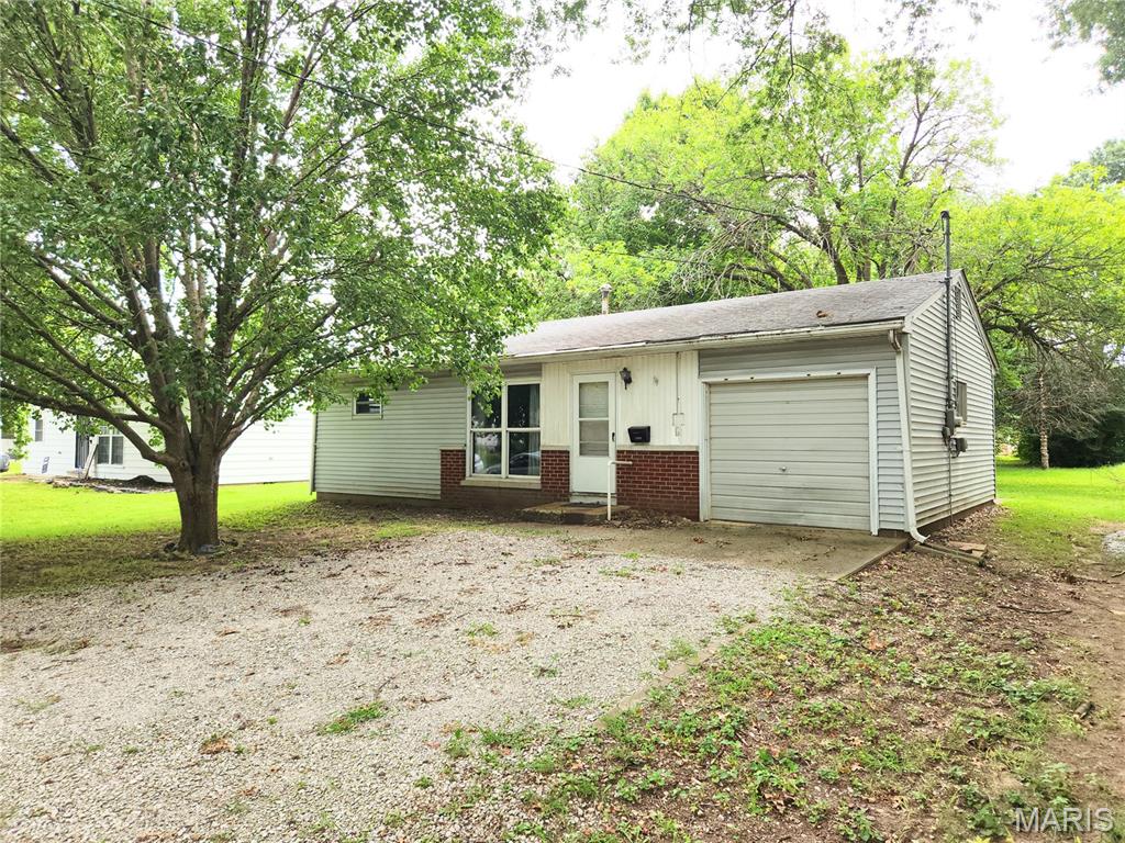 Stop Renting and Start Investing: Efficient Living in Swansea!  With a little vision and some elbow grease, this two-bedroom, one-bathroom Swansea home is a fantastic opportunity for both first-time buyers and savvy investors. Offering incredible value and a generous, level lot, this property delivers efficient living without sacrificing outdoor potential. Inside, you’ll find 720 square feet of well-planned space, featuring a comfortable living room, two bedrooms, an updated bathroom, and a kitchen equipped with a refrigerator and electric stove. Some updates have already been tackled for you, including a step-in shower and a modern 200-amp electric service - providing a perfect head start for your renovations. The attached single-car garage adds great practicality with laundry hook-ups and extra storage. Step out the back door to a 13x18 concrete patio, ideal for summer BBQs on your expansive lawn. Located just minutes from local parks and everyday conveniences, this home has the "good bones" needed to become a wonderful residence or a high-performing rental. This property is being sold AS-IS with NO Occupancy Approval. Don’t miss your chance to build equity by owning your own home!