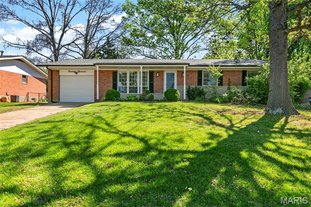 RARE 2,800 SQ FT TOTAL LIVING AREA + NEWER ROOF (2025)
Discover a rare amount of finished living space in this meticulously updated Florissant ranch. Tucked away on a quiet, tree-lined street, this home offers nearly 2,800 sq ft of total living area—double the functional square footage of a standard area ranch combining a spacious floor plan with recent updates.

MAIN LEVEL: The interior features a spacious living room highlighted by an airy vaulted ceiling, a dedicated formal dining room, and a versatile secondary living room with all with natural hardwood floors throughout. The kitchen has been fully updated with solid granite countertops, a sleek modern backsplash, and stainless steel appliances. All 3 bedrooms are located on this level along with 2 full bathrooms, both featuring custom tile work and modern finishes.

LOWER LEVEL: The professionally finished basement effectively doubles your living space. This expansive area includes a massive recreation room and an oversized bonus room—ideal for a quiet home office, private fitness studio, or guest space.

OUTDOORS: 
Attached garage featuring a large built-in storage cabinet, plus a dedicated backyard storage shed.

Fully fenced backyard featuring two concrete patios, perfect for entertaining.

Newer Roof (April 2025) for long-term maintenance-free living.

Located minutes from Cross Keys Shopping Center, you will have quick access to shopping, dining, and everyday essentials while still enjoying a quiet residential setting. This move-in-ready home provides the extra living space you’ve been looking for with the peace of mind you want. Schedule your showing today to experience the quality and 2,800 sq ft of space!