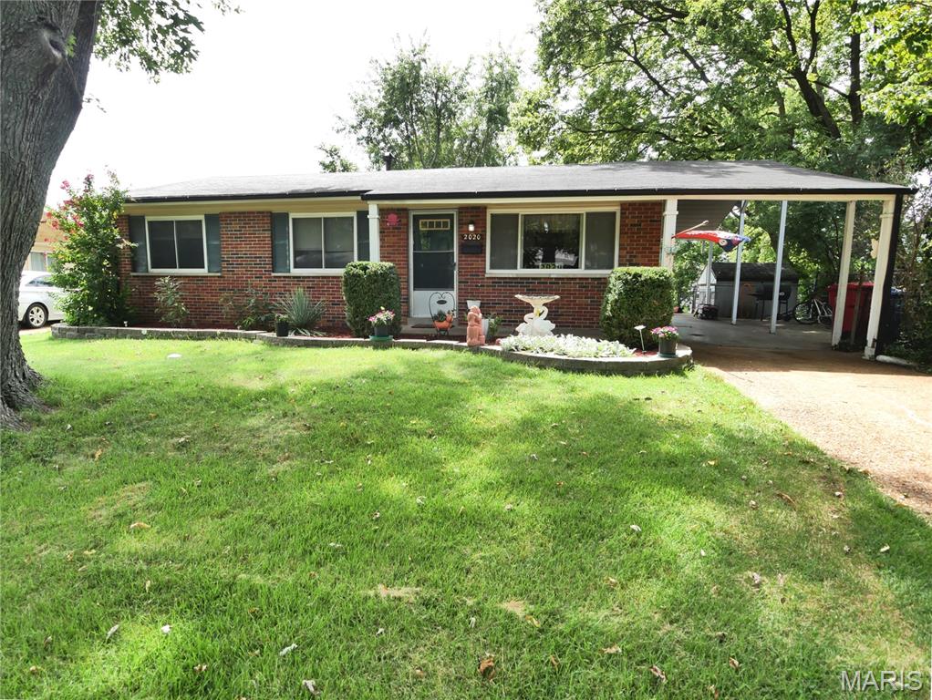 A wonderful place to call home! Welcome to this charming, well-maintained home in the beautiful Tahoe subdivision of Florissant! Offering over 1,450 sqft of finished living space, this home has the space, comfort, and outdoor living areas that make it a wonderful place for a family to grow and create lasting memories. Step the living room that opens to a spacious kitchen/breakfast rm combination that makes everyday meals and entertainment easy. Kitchen features a gas range, updated dishwasher, pantry and convenient breakfast bar; bar chairs stay as well as the refrigerator. The primary bedroom has a walk-in closet. The lower level adds even more living space with a large family room, play area, home office, hobby space, or whatever fits your lifestyle; the large desk stays. The storage room has a workbench, and the washer/dryer are included. The fenced backyard includes an above-ground pool making summertime at home even more enjoyable. The carport is an especially wonderful feature as it provides a shaded, comfortable outdoor space for barbecuing and entertaining even when it’s raining. There is also a patio area at the end of the carport, creating another great spot to sit, relax, and enjoy the outdoors. The welcoming front porch is perfect for sitting and watching the rain, enjoying your morning coffee, or simply relaxing at the end of the day. Beautiful landscaping in the front yard. Home has decorative brick and vinyl siding. Recent updates and features: new roof Aug 2026, central air 2yrs, updated 100-amp breaker box, thermal windows, new screens on the front windows. Florissant occupancy inspection passed in April 2026. And the location is hard to beat for a growing family! The home is within walking distance of Russell Elementary and Hazelwood West high school, making school access incredibly convenient. This is the kind of home where children can grow up, play in the backyard, enjoy summer days by the pool, gather around the kitchen, and make memories that last a lifetime. With its spacious living areas, finished basement, great outdoor spaces, beautiful landscaping, convenient location, and numerous updates, this home is ready for its next family to love it as much as current owners have.