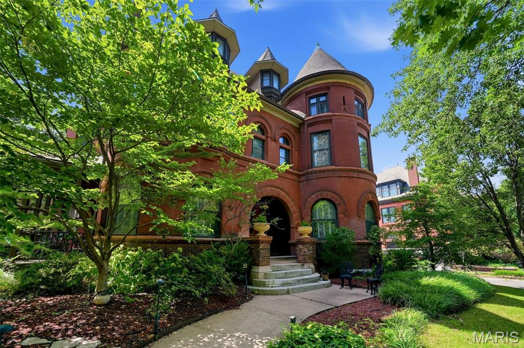 Circa 1896 A rare opportunity & timeless elegance await in sought after Lafayette Square. Built by architect Ernst Janssen in Romanesque style this stately estate is one of only a handful of homes overlooking beloved Lafayette Park. On a grand corner lot, with mature landscaping & curved drive leading to the covered & pillared stone side entry. From the towering turret to the arched architectural entryway, its grand stature and timeless elegance is unparalleled. Welcomed through a fabulous foyer, the sweeping stairwell leads to a wall of stunning stained glass that illuminates the central corridor & leads to the expansive third floor rotunda. An entertainer’s dream from parlor to formal dining room w/ built-ins, to custom cabinetry & butler’s pantry in the well appointed kitchen. The spacious salon/lounge is the place for gathering with friends and family. Plus the formal dining room awaits when you want to entertain with style. From the first level parlor & living & dining areas a second stairwell lends access outside & to the upper level bedrooms & 2 full baths. Bay & bent glass windows, bold elements are warm &breathtaking throughout. The testament to detail is unparalleled at every turn including rare round radiators, detailed wood panel walls & fireplaces with original iron covers, tile, mirrors & mantles. Inlay & parquet grace three levels of wooden floors. Built-in cabinetry & closets maintain original hinges, mirrors & craftsmanship. Original elements of pocket doors, restored millwork, elegant fireplaces & original light fixtures remain. All the bells & whistles of modern living & style are drenched in timeless detail. Meticulously maintained, the architectural bones of this brick beauty are for the ages. Now is your opportunity to realize your dweller dreams of life on the park in the heart of the one & only Lafayette Square.