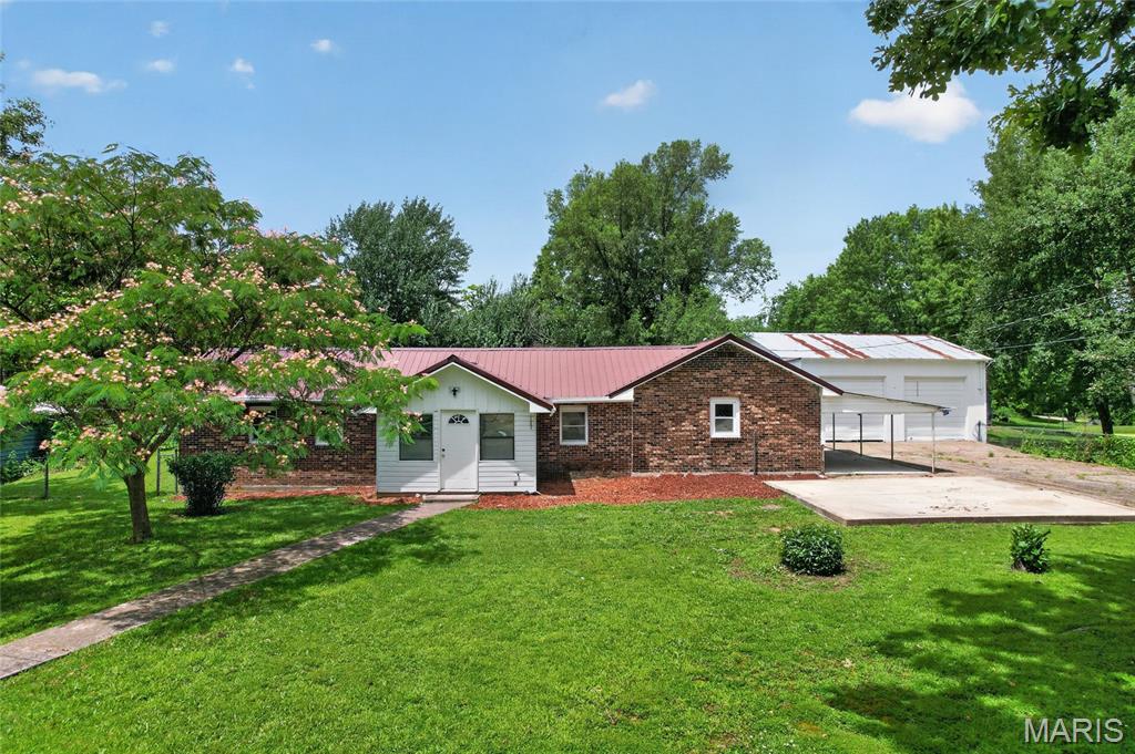 Completely remodeled and move-in ready! This beautifully renovated 3-bedroom, 2.5-bath home in Dixon, Missouri, offers the perfect combination of modern updates, space, and functionality. Situated on a large corner lot with mature trees, the property features both a fully fenced front yard and a fully fenced backyard with chain-link fencing—ideal for pets, play, or outdoor entertaining.

One of the standout features is the impressive 30' x 30' attached garage/shop, offering space for up to four vehicles and plenty of room for a workshop, hobby space, or storing your prized vehicles and equipment. Whether you're a car enthusiast, collector, or simply need extra storage, this space is sure to impress. A small storage shed is also included, providing the perfect place to keep lawn equipment, yard tools, and outdoor supplies organized.

Conveniently located approximately 30 minutes from the main gate of Fort Leonard Wood, 20 minutes from Interstate 44, and about 2 hours from St. Louis, you'll enjoy small-town living with easy access to nearby amenities and commuting routes.

Don't miss your opportunity to own this beautifully updated home with an incredible garage, spacious fenced yard, and additional storage. Schedule your private showing today!

Construction is planned to complete by 7/16/26