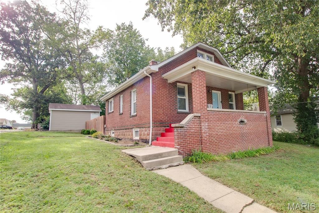 Story and a half full brick bungalow- featuring 2 bed &  2 baths. Covered front porch and a detached 1 car garage with alley access. The home features an updated kitchen and a very clean basement where laundry is located. The upstairs also has a bonus room that would be a great office space. This one is affordable and move in ready! Kitchen appliances will stay!