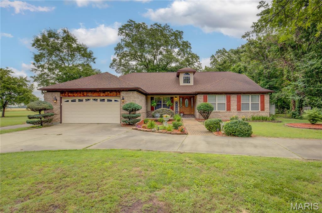 Come take a tour of this beauty!!!!  This beautiful home is so inviting and you feel it as soon as you enter the door!  You will notice the beautiful tile work right in the entrance and the high ceilings.  To the right you will find a spacious office area dn to left a formal dining space.  This home has been meticulously maintained and and can see that in all the details!  Vaulted ceiling make the main living area open and spacious with a gorgeous fireplace!  On one end of the home you find 3 large bedrooms and 2 bathrooms.  The huge primary has lots of windows and a walk in closet.  You will also notice that the primary bath is very large with double vanity and a separate shower and tub.  On the other side of the home you will find the beautiful kitchen with a pantry and dining space which is connected to the family room.  The family room has sliding doors that lead straight out to the beautiful deck.  The home also has a laundry room you enter into right off the garage.  The home sits on over an acre with a detached garage with 2 bays and is 1500 sq ft, so lots of space!  Make sure and schedule your tour today!!!