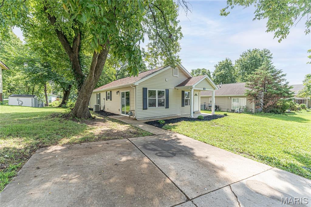 NOW ACTIVE | Wentzville, MO - Get ready to fall in love with this beautifully updated 4-bedroom, 1-bath home in the heart of Wentzville! Was off market while seller replaced the AC condenser unit and coil as well as updating the tub and shower and adding an outdoor shed. This move-in ready home features: Brand-new kitchen cabinets, Counters and appliances, new laminate flooring throughout the main living areas, new carpet in all bedrooms, see update list for complete updates. This home has main floor laundry, a nice backyard and off street parking. With modern updates and a great location, Schedule your showing today!