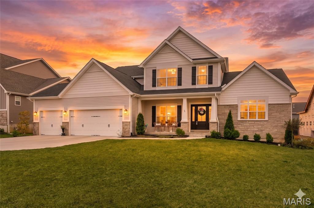 NEW PRICE!! Why build and wait? You can move into this pristine 2-year-old Designer Series Muirfield model today. Welcome to 3 Warchol Court, this better-than-new, fully upgraded home nestled on a quiet, established cul-de-sac phase in the premier Inverness Community. Skip the expensive builder markups—this turnkey luxury home completely eliminates the post-close "hidden costs" of new construction by including a fully established professional landscape package, an expansive poured concrete patio, and a multi-zone smart irrigation system already installed. Thoughtfully designed and impeccably finished, this exceptional home at 3 Warchol Court blends architectural elegance with everyday comfort. The stunning Great Room welcomes you with soaring 11-foot ceilings, sunlit transom windows, and a striking full-stone fireplace—creating a warm yet refined gathering space. The gourmet kitchen is a true centerpiece, appointed with a professional gas cooktop, stainless hood, built-in wall ovens, French door refrigerator, farmhouse sink, and under-cabinet lighting, all flowing seamlessly into the main living areas. An elevated bonus retreat, framed by a wrought-iron staircase, offers a versatile space ideal for a private office, media lounge, or playroom. The main-floor owner’s suite is a serene escape, featuring spa-inspired Calacatta-style tile, a deep soaking tub, a beautifully tiled walk-in shower with glass enclosure and matte black fixtures, dual vanities, and an expansive walk-in closet. Enhanced with programmable climate control, an Aprilaire humidifier, and a 3-car garage, this home also enjoys access to Inverness’ 106-acre setting with lakes, trails, pickleball courts, and top-rated Wentzville schools. Lake Forest Country Club is just a quick golf cart ride away, with private golf and social memberships as well as pool and pickleball seasonal passes available. 
Lock in your timeline and bypass the stress of construction trucks, noise, and mud.