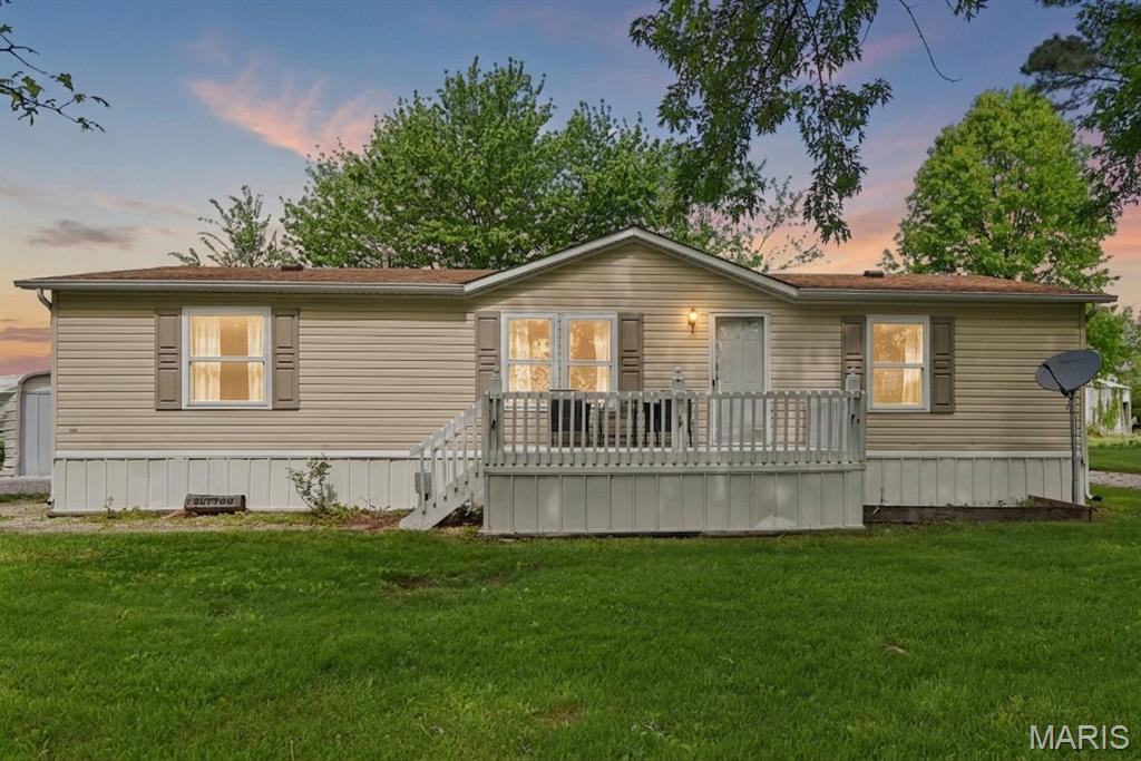 MAJOR PRICE REDUCTION! This property was recently rezoned to Commercial, offering a variety of potential business and investment opportunities while still providing the space and comfort of country living. Situated on approximately 3 acres with no HOA and no restrictions, this unique property offers exceptional flexibility and convenient access to Highway 70.
BACK ON MARKET – NO FAULT OF SELLER!
Escape to this serene retreat near Pinnacle Lake, where breathtaking natural beauty and quiet surroundings offer the perfect balance of privacy and relaxation. Whether you're looking to unwind or reconnect with nature, this inviting setting delivers.

This well-maintained 3-bedroom, 2-bath home features 1,248 square feet of living space with beautiful views of the surrounding open fields. Enjoy evenings on the shaded front porch or peaceful mornings on the covered back porch overlooking the acreage. The kitchen includes a center island and a stunning wall of windows that fills the space with natural light and scenic views. The primary suite features a relaxing garden tub.

Recent updates include newer vinyl plank flooring in the living room and two bedrooms, all-new windows installed in 2024 with a transferable warranty, and a new well pump, wiring, and pressure tank installed in 2024. Additional features include electric forced-air heating, a shared well, septic system, and road access.

Outside, you'll find a detached outbuilding and two additional storage sheds, providing ample storage and workspace. Partial fencing offers potential for horses or livestock, and an invisible dog fence with two collars is included. A circular driveway adds both convenience and curb appeal.

Whether you're seeking a residence, business location, investment property, or a combination of uses, this versatile property presents a rare opportunity. Buyer to verify zoning and permitted uses.