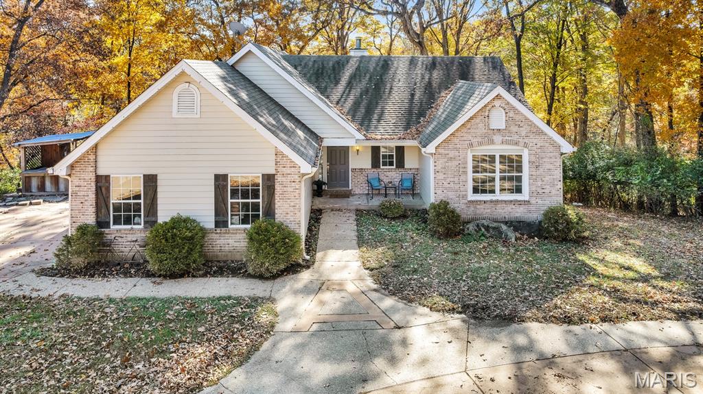 Back on market — previous contract did not proceed to closing. This is a rare second chance at a property that is increasingly difficult to find. Over 4 private acres with no HOA, a quiet private road, and an oversized detached 3-car-plus garage — all within the highly regarded Rockwood R-VI School District.

The ranch floor plan offers comfortable main-level living with 4 bedrooms, 3 full baths, a spacious great room with fireplace, and a walk-out lower level providing an additional 1,676 square feet of finished and partially finished flex space. The lower level includes a family room with a second fireplace, a fourth bedroom, full bath, and recently installed carpet.

The main level features luxury vinyl plank flooring in the great room and dining room, ceramic tile in the kitchen and breakfast room, and beautiful bay windows that bring natural light throughout the home.

The oversized detached garage offers exceptional versatility for vehicles, hobbies, workshop space, equipment storage, or recreational toys. A walking path connects to the wooded acreage, providing genuine privacy and room to expand, garden, explore, or simply enjoy the outdoors.

Priced at $569,000, this property offers a unique opportunity for buyers to add their own updates and personal touches while benefiting from the value of the acreage, location, and improvements already in place. Move-in ready as-is. Seller concessions available. Conventional, FHA, and VA financing welcome.