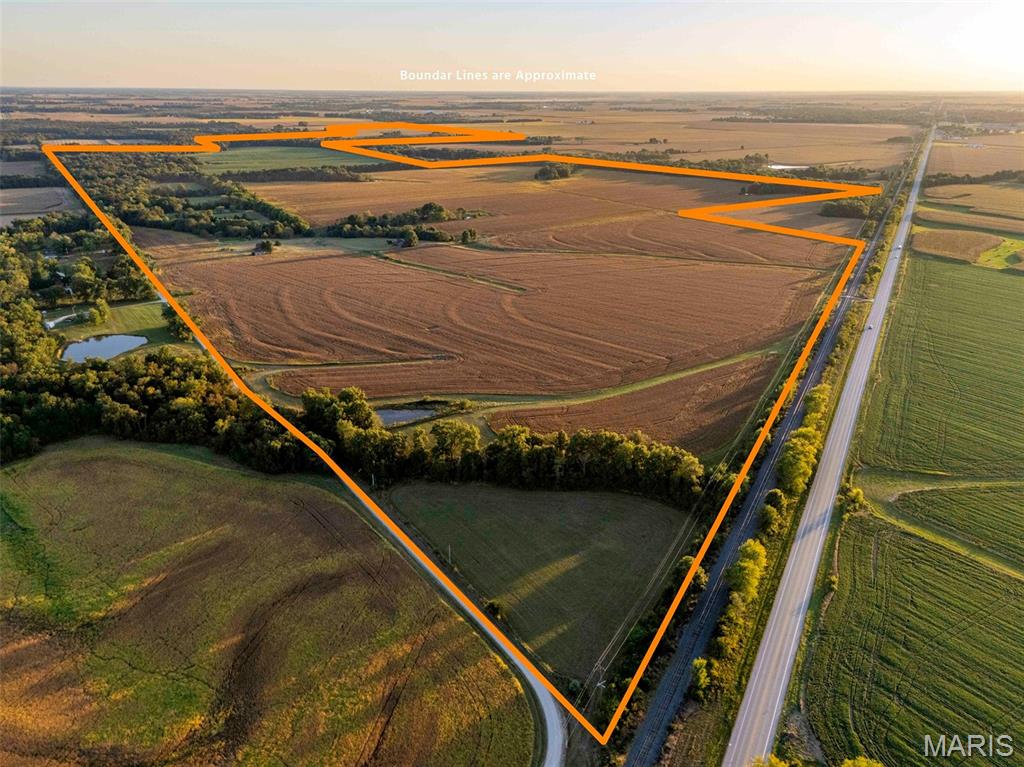 Large farms with this balance of productive tillable acres, hardwood timber, and pasture are rare — and this one delivers it all and more. Just a few miles east of Vandalia, Missouri, this 622.69-acre farm combines strong income potential with premier recreation. With 400 acres of highly productive tillable ground, 165 acres of mature timber, and 38 acres of pasture, it provides reliable annual returns alongside excellent long-term appreciation potential. The tillable acres are well-suited for row crop production and cash rent opportunities, while the pasture adds flexibility for livestock, hay, or additional habitat management.

This farm also offers outstanding access, making both farming operations and recreation convenient. The north boundary fronts Highway 54, the south connects to State Hwy V, and additional county road frontage lies on the northeast and southwest corners. The diverse layout is equally suited for hunting, with timber, crop field edges, and ponds creating an ideal habitat for wildlife. Well-known for producing trophy whitetail and an abundant turkey population, this property is a true sportsman’s destination.

Whether you’re an investor seeking a stable land asset, a farmer expanding operations, or an outdoorsman looking for a farm that pays while you play, this property checks every box. Large, diverse tracts of this caliber are hard to find — don’t miss your chance to own a showcase farm with both strong income and lifestyle value.