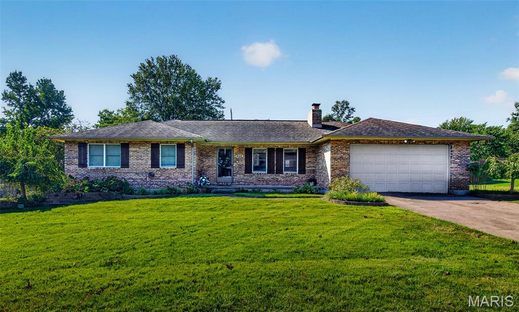 Wonderful all brick ranch home in a great neighborhood!  Renovated just a few years ago!  Roomy kitchen open to the dining room with plenty of room between for the moveable island!  Gas log fireplace in the living room with built in shelves on both sides.  Huge laundry room with storage closet.  Primary bedroom has a private bath with dual sinks and a custom tiled, no step, walk in shower!  3 bedrooms and 2 full baths.  Check out the huge elephant ears in the front flower beds!  
Beautiful landscaping.  Covered back deck that overlooks the back yard.  Wood privacy fence, a shed and another 16x12 building that is insulated, carpeted and has a/c!  This is a nice home!