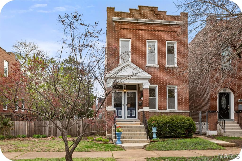 Welcome to 2650 Pennsylvania, a "diamond in the rough" Tower Grove East home that is located on a quiet, dead end street with original woodwork! What could make it even better than that you ask? Well, the property is located on a RARE double-lot in the city! The curb appeal is amazing, and the wow factor continues when you walk into the bright and spacious first floor that has tall ceilings and extra large rooms. The first floor has a living room, a separate dining room with a built-in cabinet, and a large eat-in kitchen. Two things that make this home stand out from similar homes built in the early 1900's is that there is a half bath, and also a laundry room with jumbo size washer and dryer located on the main floor as well! Upstairs you will find three bedrooms, with the primary bedroom having an exposed brick wall, a bathroom complete with a clawfoot tub and separate shower, plus a small deck to overlook the backyard. There are also two other good sized bedrooms upstairs (one having an original functioning pocket door!), and another full bathroom. Off-street parking? We've got you covered! There is a fully insulated and drywalled two-car garage that is perfect for an office or an entertainment space complete with LVP flooring and window unit A/C! Don't need that extra space? Then you can easily transition it back to a standard garage. There is a small storage space built in to the back of the garage that can be used to house all of your yard work tools and anything else you may want to store. The backyard features a beautiful variety of mature, fruit-bearing trees, including a lush peach tree that produces abundantly each season, a cherry tree known for its plentiful Rainier cherries, a fig tree with exceptionally tender fruit, a grape vine that produces grapes every year, and a raspberry bush that consistently gives juicy berries! There is also a vibrant mix of hibiscus varieties that add stunning color and charm! Close to everything that Fox Park and Tower Grove have to offer, it is a prime location. Schedule your showing today!