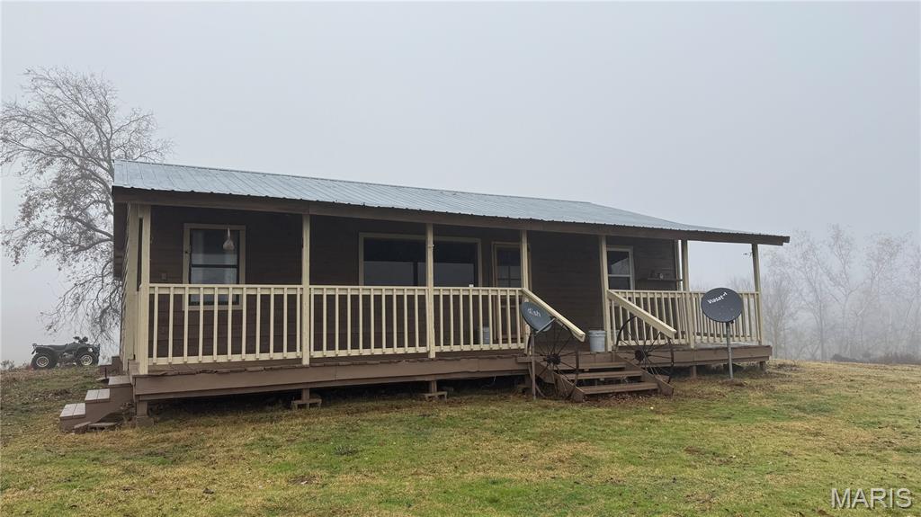 Check out this awesome 44 acre +/- property with a home, barn, shop, pond carport and much more listed for only $249,900!! This property is priced to sell! With a mix of pasture and woods this property is perfect for the hunter, farmer or both! The home features 3 bed and 1 bath and is the cutest cabin feel with central HVAC, wood stove for backup, nice kitchen and beautiful views off of the front and back porch! The property has been cleaned up some since storms last year but still needs some cleanup, fence work, and love but is priced accordingly and won't last long! Yearly real estate taxes are under $400 for 2025! The white line in aerial picture is the legal deeded easement into property. Property can be purchased with an additional 40 acres in front MLS # 25079900. 

Property is approx. 20 miles West of Doniphan in Gatewood MO. Buyer must be pre-qualified for showing and property will only qualify for cash or conventional loan.