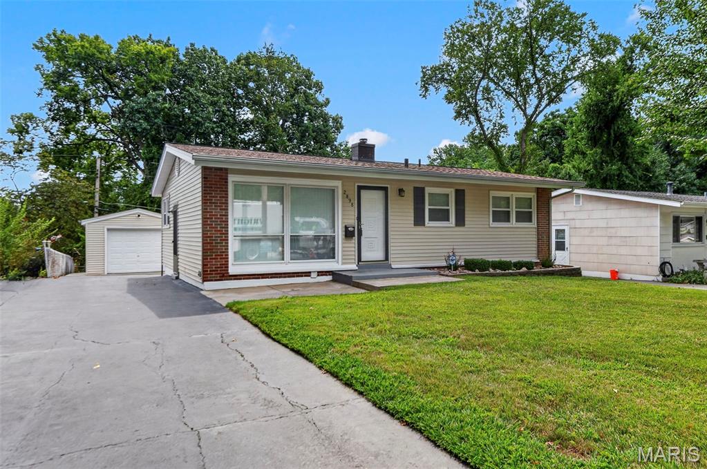 Charming 3-bedroom, 1-and half bath home with an updated kitchen and remodeled upstairs bathroom. Features a new roof on the house and garage , new siding, and concrete work in the backyard and driveway and new double hung windows thru out the home. Enjoy a finished rec room in the basement and a detached 1-car garage. Conveniently located across the street from a park and close to schools.