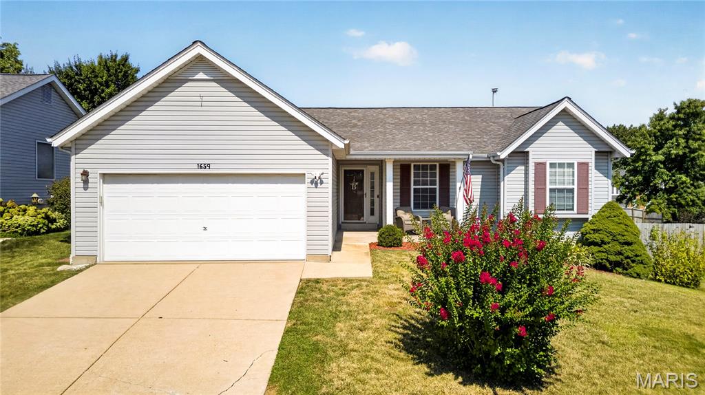 A warm, classic interior sets the tone in this tastefully updated Brennans Glen ranch! Move-in ready and a prime location, this home features hardwood floors throughout the main level, three bedrooms including a primary ensuite, and a fourth sleeping room in the finished basement for added versatility. The kitchen showcases granite countertops, maple cabinetry, and a comfortable eat-in area with direct access to the private and level yard. Enclosed by white vinyl fencing and a secluded feel, this yard is perfect for entertaining on summer nights or quiet mornings on the patio. The primary bedroom suite includes a bay window and an updated private bath. A second full bath, main floor laundry, and two-car garage completes this level. The polished finished basement expands the home even further with a half bath, media area, hobby space, generous storage, and a fourth sleeping area - featuring a closet, recessed lights, and abundant natural light! Located in a sidewalk-lined neighborhood with an easygoing feel, Brennans Glen keeps you close to highways, dining, and shopping at Gravois Bluffs, while still giving you a setting that feels tucked away.