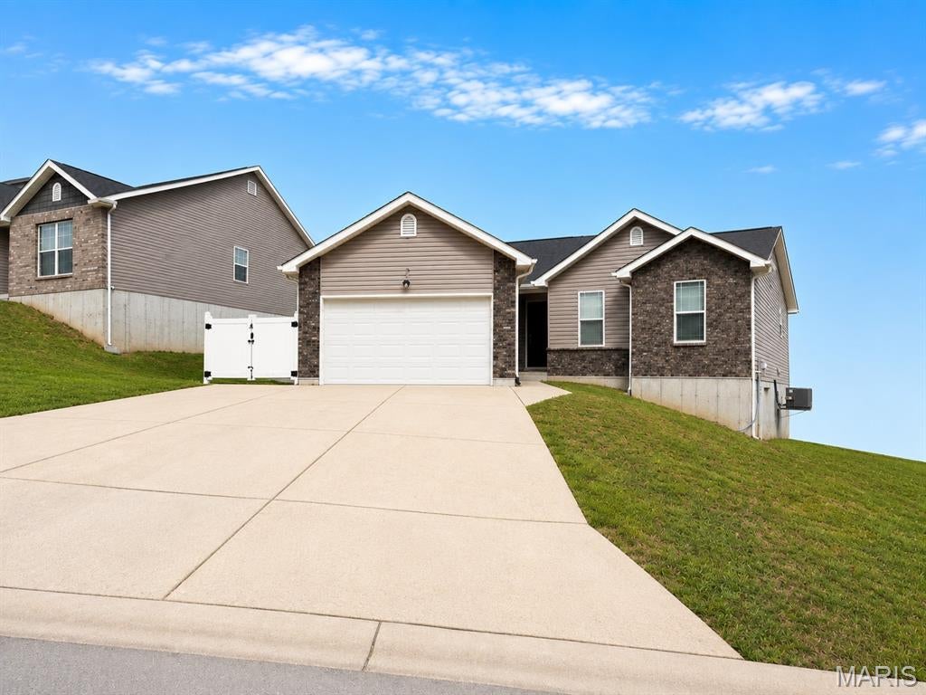 The holidays are right around the corner—what better way to start the season than settling into a new home with plenty of time to make it your own! Built in 2019 and located in Providence Subdivision, this move-in-ready home offers 4 bedrooms, 3 full bathrooms, and an impressive fully finished walkout lower level that creates an exceptional second living space.
The spacious primary suite features a walk-in closet, while downstairs you'll find a fourth bedroom with its own walk-in closet and full bath, a generous living area, and a convenient kitchenette complete with a sink, stove, and microwave—offering plenty of flexibility for guests, extended stays, entertaining, or simply having room to spread out.
Freshly painted walls, doors, trim, and baseboards give the home a clean, refreshed feel, while newer stainless steel appliances and a brand-new roof installed in July 2026 add even more peace of mind.
Highly motivated sellers have this home offered at $319,900 in the sought-after Festus R-VI School District! With the holidays quickly approaching, now is the perfect time to make your move, get settled in, and start creating memories in your new home.