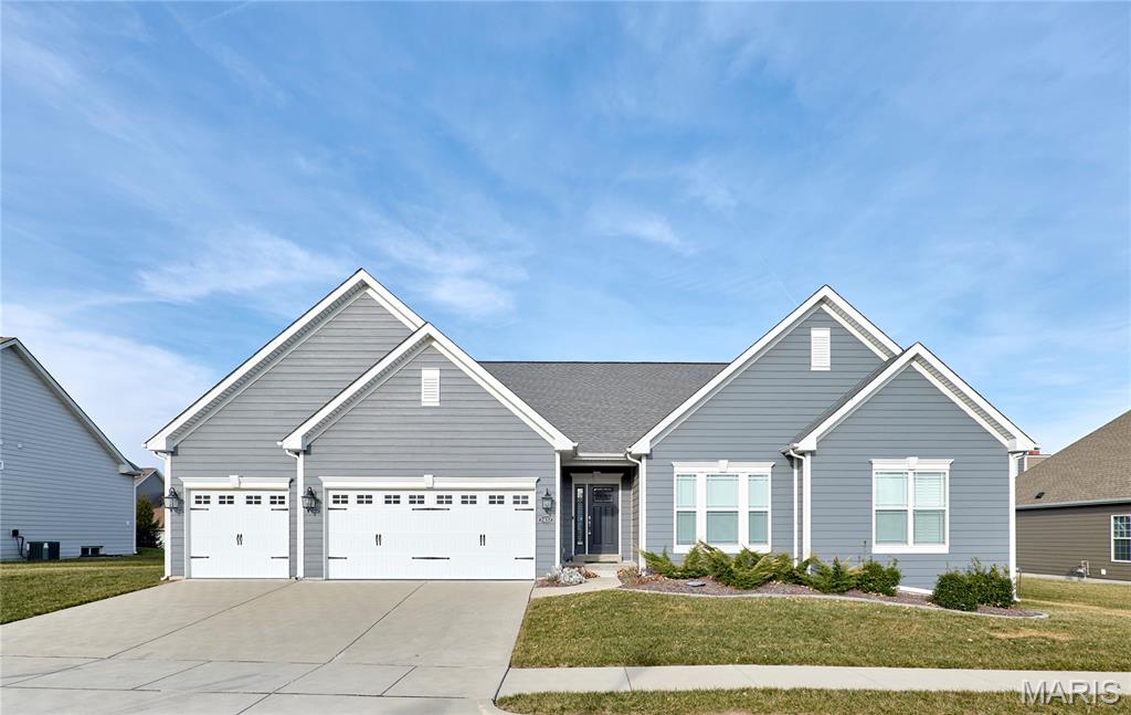 Bright 3BR/3BA ranch with 2,101 sqft designed for easy, everyday living. Step into a welcoming entry that opens to a sunlit great room flowing into the eat-in kitchen—ideal for weeknights and weekends alike. Main-level laundry sits just off the kitchen for added convenience. Enjoy indoor-outdoor living in the sunroom with retractable remote screens, plus access to a concrete patio for coffee, relaxing, or hosting. Primary suite offers a private bath and walk-in closet; two additional bedrooms share a full hall bath. 3-car garage and an unfinished lower level ready for your vision. Conveniently located across from Wildwood Town Center.