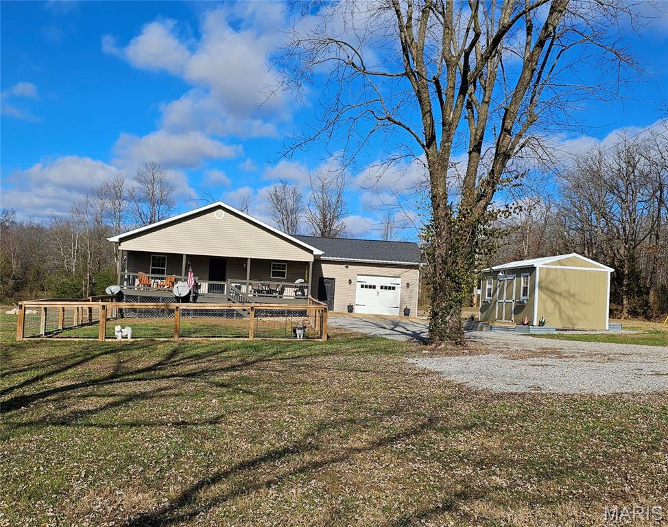 MOTIVATED SELLER-----Built in 2024, this beautiful 4-bedroom, 2-bath home offers modern comfort with a spacious open-concept layout featuring the living, dining, and kitchen areas—perfect for everyday living and entertaining.
The primary suite includes a private ensuite bath and a walk-in closet. Enjoy relaxing on the full covered front porch, and appreciate the convenience of a 1-car garage with remote entry, interior access, and a split heating and cooling unit seller had installed.
The kitchen is well-appointed with stainless steel appliances, a new gas stove and oven, a large island bar, and abundant cabinet space. Additional features include a new Generac whole-home generator and Trane whole-home humidifier both recently installed. 40-gallon hot water heater, vinyl flooring throughout, faux wood blinds, and vinyl windows with screens.
Outside, you’ll find newly installed  gutters with gutter guards, newly installed custom fencing with solar lighting, and a 10x20 storage shed for extra storage. Spacious and inviting, this home offers peaceful country living while being just minutes from town.  This home has it all, charm, and is prepared for power outages all the time.  Seller has planted a few young trees and has some cute landscaping.  Come take a look, this home checks all the boxes.