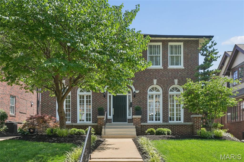 Welcome to this stunning full brick two-story home, lovingly maintained by its current owners for 26 years and showcasing timeless character with thoughtful custom updates throughout. From the moment you arrive, the home’s exceptional curb appeal and charming arched leaded glass window framing the front door set the tone.
Step inside to a gracious entry foyer featuring custom molding, seamlessly opening to both the elegant living and dining rooms. The living room is rich in character with custom French doors, stained glass windows, and a cozy fireplace, and flows effortlessly into a sun-drenched sunroom complete with electric heated floors and transom windows—an ideal space to relax year-round.
The dining room mirrors the home’s charm with its own French doors and stained glass accents. The unique handcrafted Murano glass chandelier from Italy is timeless and a true piece of art. An exquisite custom kitchen designed for both beauty and function. Highlights include high-end Viking appliances, custom cabinetry with integrated lighting, striking quartz waterfall countertops, and a wall of windows overlooking the picturesque flagstone patio, walkway, and backyard. Radiant heated floors in the kitchen and back hallway.
A graceful curved staircase leads to the second floor, where you’ll find the primary suite with an attached sunroom, along with three additional bedrooms. The updated bathroom offers a double bowl vanity, soaking tub,separate shower, and electric heated floor.
The finished walk-out lower level offers exceptional versatility and style, featuring a family room with gas fireplace, full bath with electric heated floor, laundry area, ample storage, and a unique bedroom nook complete with a full-size bed, built-in storage, plantation shutters, and its own TV—an impressive and cozy retreat.
Additional features include hardwood flooring throughout the main and second floors, custom light fixtures, recessed lighting, and an abundance of natural light throughout the home. Completing the property is a detached oversized two-car garage.
This one-of-a-kind home blends classic charm with modern amenities in every detail—truly a must-see.