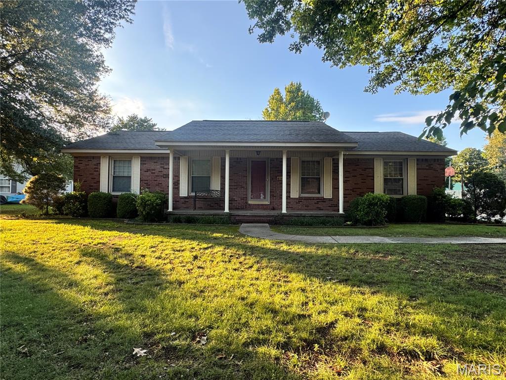 Welcome home to this beautiful brick residence nestled in a well-established neighborhood with mature shade trees and situated on a generously sized lot. Offering approximately 1,556 square feet of living space, this home combines timeless curb appeal with comfortable everyday living. The property features three bedrooms, two bathrooms, spacious living areas, and a functional floor plan designed for both relaxation and entertaining. The large lot provides plenty of room for outdoor activities, gardening, or simply enjoying the peaceful setting. A covered carport and detached storage building add convenience and additional storage options.

Located in a desirable area of New Madrid, you'll appreciate the quiet neighborhood atmosphere while remaining close to local schools, shopping, dining, and community amenities. Whether you're looking for a family home or a place to enjoy small-town living, this property offers an excellent opportunity.