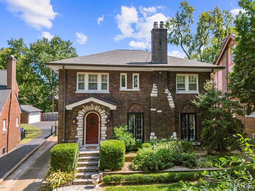 Tree-lined Yale Avenue sets the stage for this charming University City home, where original character and thoughtful updates live happily together. The living room features a set of distinctive French doors with pretty metal grills that surround the  gorgeous stone fireplace. The living room opens into a spacious dining room that is adjacent to the updated kitchen that includes custom cabinetry, granite countertops, stainless appliances, and a convenient pantry. A bright and useful mudroom leads to the gorgeous brick patio, glorious gardens, and fenced backyard—perfect for morning coffee, happy hour, or letting everyone (and everything) run free. Upstairs, four generously sized bedrooms share a large, beautifully updated bath with a jetted tub, while three—yes, THREE—linen/storage closets keep life organized on the second floor. Original hardwood floors throughout the main and second levels are in wonderful condition and add warmth at every turn. The finished lower level delivers even more fun with a rec room, play space, full bath and laundry room - the washer/dryer stay - plus a great storage room with built-ins. A convenient entrance to the lower level from the driveway is especially useful and you can add to that a detached two-car garage that includes built-in storage. Charming ... comfortable ... and full of surprises—this Yale Avenue gem is waiting to welcome YOU home!