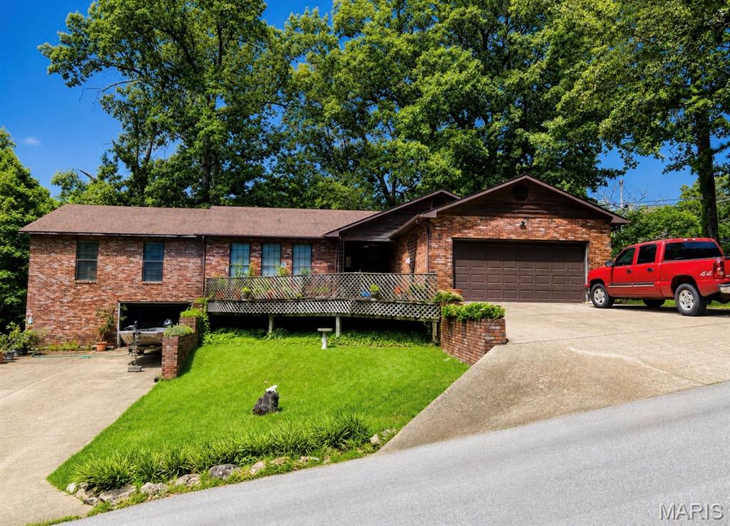 Beautiful 4-bedroom, 3-bath brick home located in the highly sought-after Fox Drive neighborhood of Doniphan! This spacious home offers a desirable split-bedroom floor plan and a full unfinished basement with endless potential for additional living space, storage, or a workshop. The impressive 720 square foot primary suite serves as a private retreat featuring a large walk-in closet with space for a washer and dryer, plus an oversized en-suite bath with a walk-in shower. The three additional bedrooms and two full baths are situated on the opposite end of the home, providing privacy and comfort for family or guests. The kitchen features an abundance of beautiful oak cabinetry with plenty of storage and workspace. Step outside onto the large walkout deck, perfect for grilling, entertaining, or simply relaxing while enjoying the peaceful setting and mature trees. With quality brick construction, generous living space, and an excellent location in one of Doniphan’s most desirable neighborhoods, this home offers exceptional value at $250,000. Don’t miss your opportunity to make this wonderful property your new home!