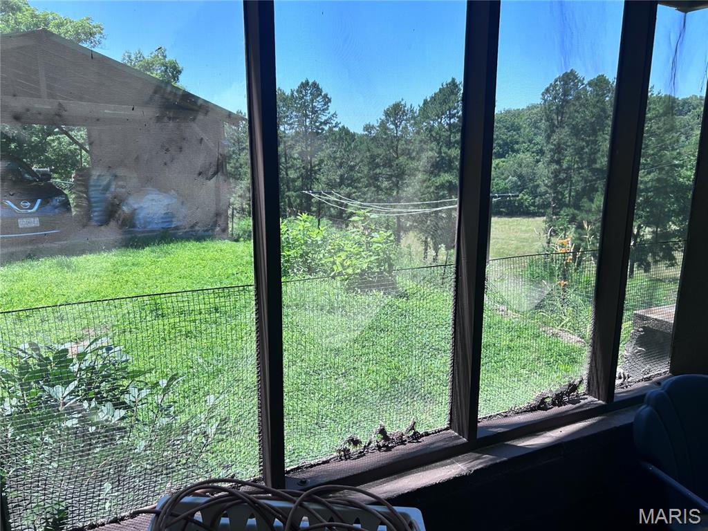 STURDY HOME on FARMETTE only 2 miles from town!  Looking for a lifetime view? How about Pasture & beautiful blooming flora? +++ a home that has it all - 3 bedrooms, 2 full baths, Central H & A + Pellet Stove,  gobsmacked storage, screened enclosed perfect sized covered patio, 2 car - carport could be converted to garage, well, barn, shop, animal containment areas, pasture, woods, Pond, wildlife and more!  Property has a chain link fence around the home and woven wire fencing on perimeter of the property. This sweet home was built right! Tons of concrete make it stable, master builder was owner and his skill shows.  Kitchen has a dining room on one side and breakfast nook on the other between the amply cabinets & easy care working kitchen.  Appliances that are there stay with the property.  Capture this view from the home and the North winds from the screened in porch or upstairs over-looking this incredible valley puts your eyes over all that can been seen; pastureland, large Pines lining the North perimiter and no close neighbors give you freedom of enjoyment.  How do you say; Perfetto, Parfait, Perfekt, no matter how you spell it ... it's perfect.