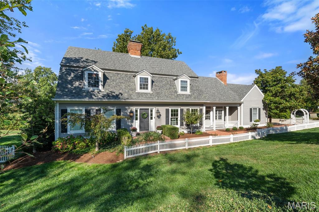 This New England inspired beauty is sure to win your heart! Nestled on a private 1.24 acre lot, this 4345 sq ft, 5 bedroom home is unique in its understated elegance. The showpiece of the home is the lovely sun drenched great room with a wall of Palladian windows overlooking the graceful yard.  Architectural features abound, and blend with the dazzling open kitchen with Danby marble countertops, stainless appliances, outstanding built ins, and cozy hearth; all reminiscent of a country inn.  Enter the multi use open living room where one can enjoy a reading nook , visiting area, or elegant dining. Adjoining the living room is a lovely half bath, and entry to the covered deck. The convenient first floor primary bedroom has a walk in closet, ensuite luxurious bath with marble countertops, soaking tub, separate shower, and a laundry room. There are 2 staircases to the second floor, which contains 4 ample bedrooms, some with walk in closets, and 2 full updated baths. The lower level with half bath has walk out access and boasts abundant uses for gatherings, hobbies, and recreation.  Enjoy entertaining on the delightful covered deck with charming gazebo area and newer built in gas grill overlooking the lovely landscaped yard.  There is a 2 car garage, mud room, sprinkler system, and alarm system. What a great location in Parkway West schools, convenient to Town and Country "Town Square" with a variety of shops, restaurants, walking paths and "meet and greet" venues! Don't miss  this fantastic home!