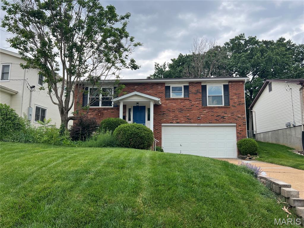 SPACIOUS 3BR/2BA IN WEBSTER! STUNNING GREAT ROOM ADDITION! WALK TO WEBSTER REC PLEX! Enter to open 2-story split foyer & up to main level with newer laminate wood flooring throughout. Large dining room with oversize picture window that overlooks the front yard. Adjacent eat-in-kitchen boasts stainless steel appliances & granite counters is open to the great room. Here you'll find a vaulted ceiling, woodburning fireplace, large picture window overlooking the aggregate patio, & quality Anderson sliding doors out to the covered deck. Step down from the deck to the lovely level, well-cared-for landscaped backyard surrounded by 6' wood privacy fence. Back inside you'll find the primary bedroom with updated private full bath, 2 additional bedrooms, & updated full hall bath. Lower level with family room, laundry room with sink, storage, storm shelter space, & access to the oversize 2-car garage. NEW roof, gutters, & downspouts in 2024. New HVAC & windows in 2021. MUST SEE!