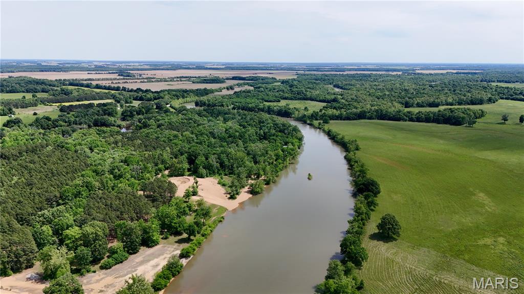 Take a look at this rare opportunity to own your own piece of real estate paradise on Current River! This 3.74 +/- acre property boasts a 2670 +/- 3 bedroom 2 bathroom log cabin style home, two detached shops with concrete floors, and a PRIVATE boat ramp! The property sits just 12 minutes south of Doniphan, Missouri, just seconds across the Arkansas state line. No long gravel roads to access this home as it sits approximately 1/4 mile off of the highway down a short well-maintained gravel driveway. This home is currently listed on Vrbo and has an established yearly income with no limit on it's potential. If you know anything about Current River, you know how hard it is to find a property like this that truly checks all the boxes. Approximately 43 minutes to Poplar Bluff Missouri, call today and make it yours!