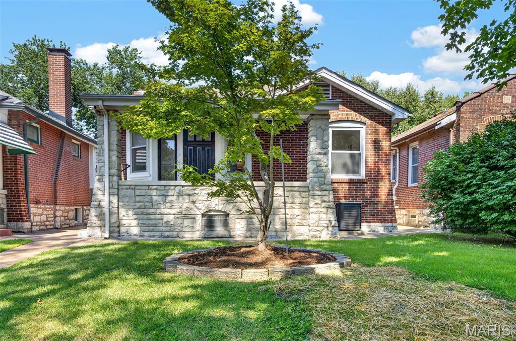 Discover refined living at 4005 Dover PL in the sought after community of Holly HIlls STL. This completely remodeled bungalow originally constructed in 1927 offers old world charm with modern upgrades for every day convenience. The recently updated kitchen is designed for both culinary exploration and casual gatherings, featuring a convenient peninsula for additional counter space and informal dining. The living room is a warm welcoming space featuring ornate hand painted glass windows offering the perfect charming touch. The back yard offers inviting outdoor spaces, including a private patio and a welcoming porch, extending your living area into the open air, as well as the convenience of a 2 car garage with direct alley access. Experience the seamless blend of historic character and modern updates this home offers; schedule your private viewing today.