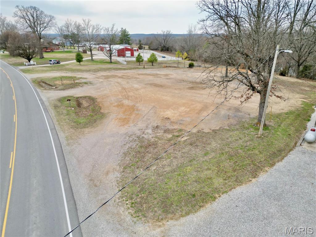 Prime commercial opportunity just minutes from the interstate! This highly visible property, located approximately 1/4 mile off the exit, offers excellent access and exposure for a variety of business ventures. Situated on a little over an acre, the lot provides ample space for development and flexible layout options.  Ideal for a convenience store, gas station, Dollar General, storage units, or other retail or service-based businesses, this property is perfectly positioned to capture both local and highway traffic. Electric is readily available, making it even easier to bring your vision to life.
Whether you’re looking to start a new business or expand your investment portfolio, this location offers outstanding potential in a growing and accessible area.