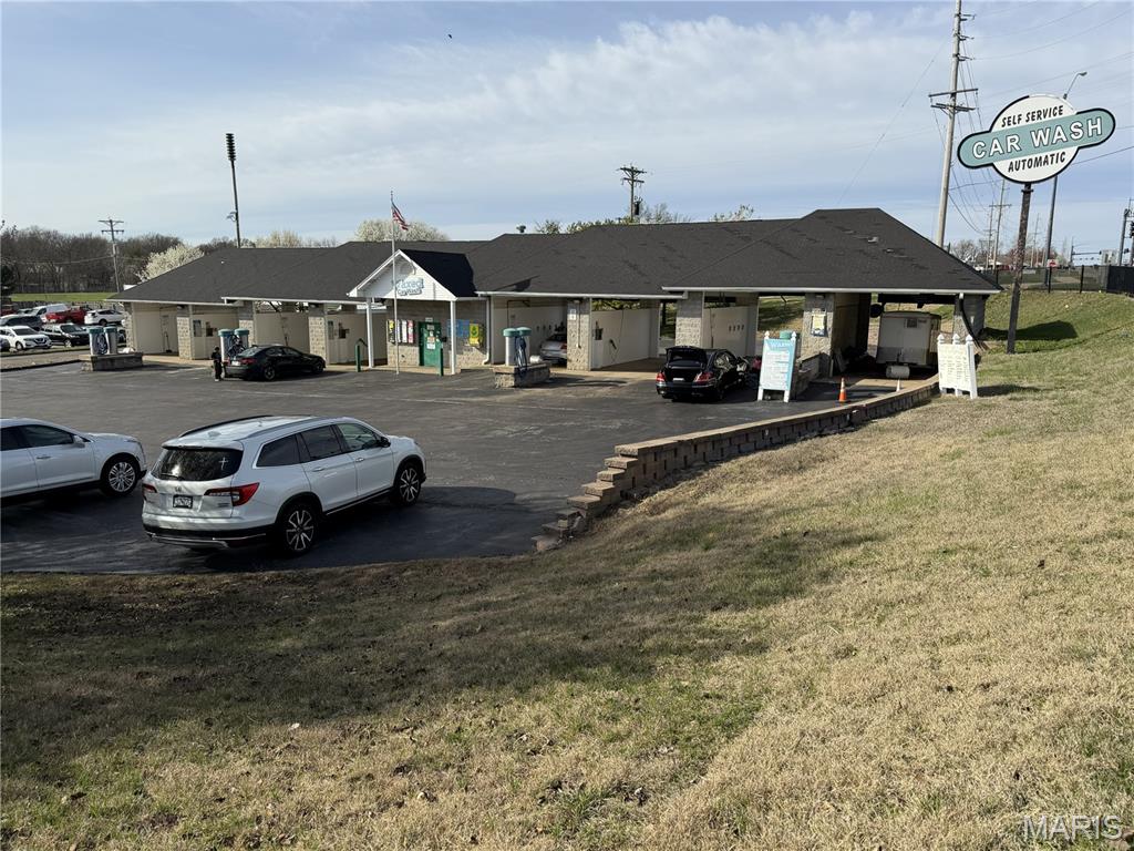 This exceptional .92+/- acre redevelopment property is located at the Northwest corner of Hwy K  and Babble Creek Lane in O'Fallon, MO. Freddy's restaurant is adjacent and located on the Southwest corner making this a highly desirable commercial corridor with high visibility, and easy access with a center turn lane on Hwy K. Currently, the site is operating as a car wash. This versatile retail or commercial location offers incredible potential for redevelopment for a variety of other retail or commercial uses. Property is on the market and is subject to a Pending Mutual Release of Earnest Money.