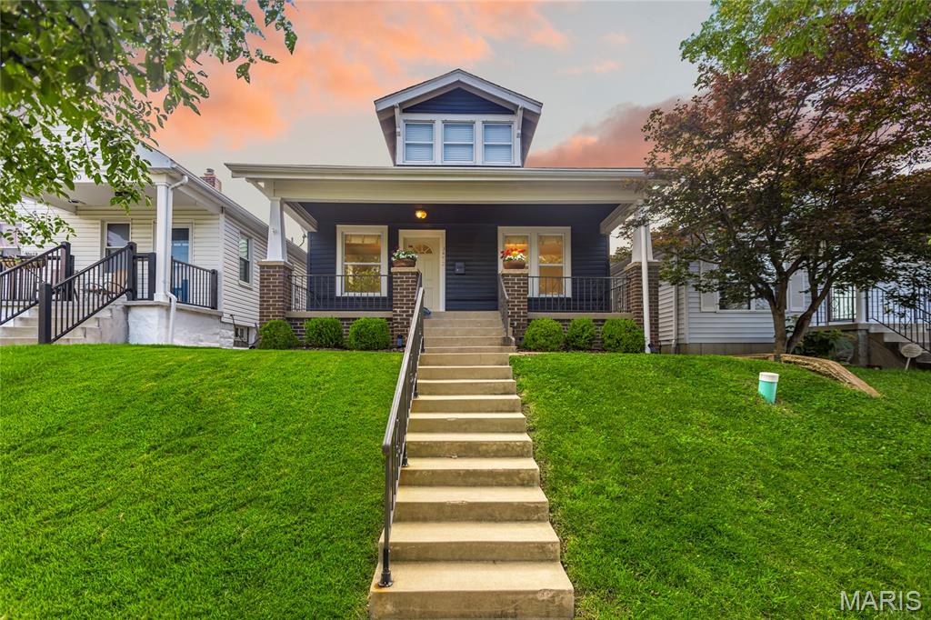 Charming 1.5 story home tucked into one of St. Louis City's most sought-after neighborhoods. This move-in ready home offers 3 Bedrooms, 2 Bathrooms, and over 1,200 square feet of living space! The main floor master suite offers everyday convenience, while original hardwood floors add timeless character throughout. Entertain effortlessly in the generous living room, dining room, and kitchen featuring granite countertops and stainless appliances. Upstairs, two additional bedrooms each with walk-in closets, served by a full bathroom. Relax outside on the front porch or the fully fenced, level backyard with a patio and two-car garage. Located near restaurants, shops, grocery stores, parks, and more!