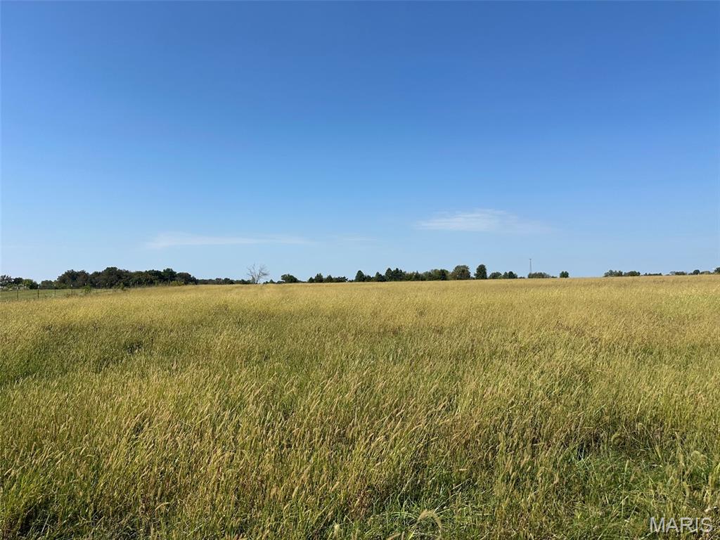 Discover 4.06 acres of open, level ground in the peaceful countryside just outside Fulton. This tract provides a beautiful rural setting with wide-open views and plenty of space to build the home you’ve been envisioning. Enjoy easy access to town while still experiencing quiet country living. Ideal for a new build, hobby farm, or weekend retreat. Lots will be developed with a gravel road, fiber, electric, and water connections. Additional adjoining tracts are available. CR 404 is reported to be paved in coming years, see new article. Prospective buyers, please ensure you have a preapproval letter or proof of funds ready before scheduling a showing. Buyer to verify all measurements and online data