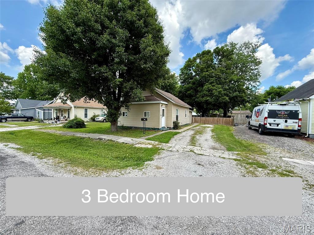 Welcome home to this charming and move-in ready 3-bedroom, 1-bath residence in Girard, Illinois. Conveniently located directly across from a neighborhood park, you’ll enjoy easy access to green space, recreation, and beautiful views right outside your front door.
From the moment you arrive, you’ll appreciate the home’s attractive vinyl siding, architectural shingle roof, and welcoming curb appeal. Step inside through the enclosed front porch, a versatile space that can serve as a mudroom, sunroom, or cozy sitting area.
The spacious living room offers plenty of room to relax, entertain guests, or spend quiet evenings at home. Just beyond, the generously sized kitchen provides ample cabinet space for dishes, cookware, and small appliances. The flexible layout offers room for a large dining table or the addition of a center island, making it easy to customize the space to fit your lifestyle. Included appliances include the range, dishwasher, washer, and dryer.
The primary bedroom features a desirable walk-in closet, while the second bedroom offers a large closet with mirrored sliding doors. The third bedroom, located just off the kitchen, is ideal for use as a guest room, home office, nursery, or hobby space. A full bathroom with a tub/shower combination serves the home, and main-floor laundry adds convenience to everyday living.
Outside, you’ll discover a large backyard designed for enjoyment and relaxation. The partially fenced yard features multiple patio areas, creating the perfect setting for grilling, entertaining, gardening, or simply enjoying the outdoors. A storage shed provides additional space for tools and lawn equipment.
Comfort is provided year-round with central air conditioning and a forced-air furnace.
This home is move-in ready and offers an excellent opportunity for buyers looking to add their own personal touches over time. While comfortable and functional as it sits today, a little sweat equity could go a long way toward increasing value and creating the home you’ve always envisioned.
Whether you’re a first-time homebuyer, downsizing, or looking for an affordable home with room to grow, this property offers space, potential, and a fantastic location. Picture yourself enjoying your morning coffee on the enclosed porch, taking an evening stroll through the park across the street, or hosting family and friends in the spacious backyard. This is a place where you can move right in, settle comfortably, and make it uniquely your own.