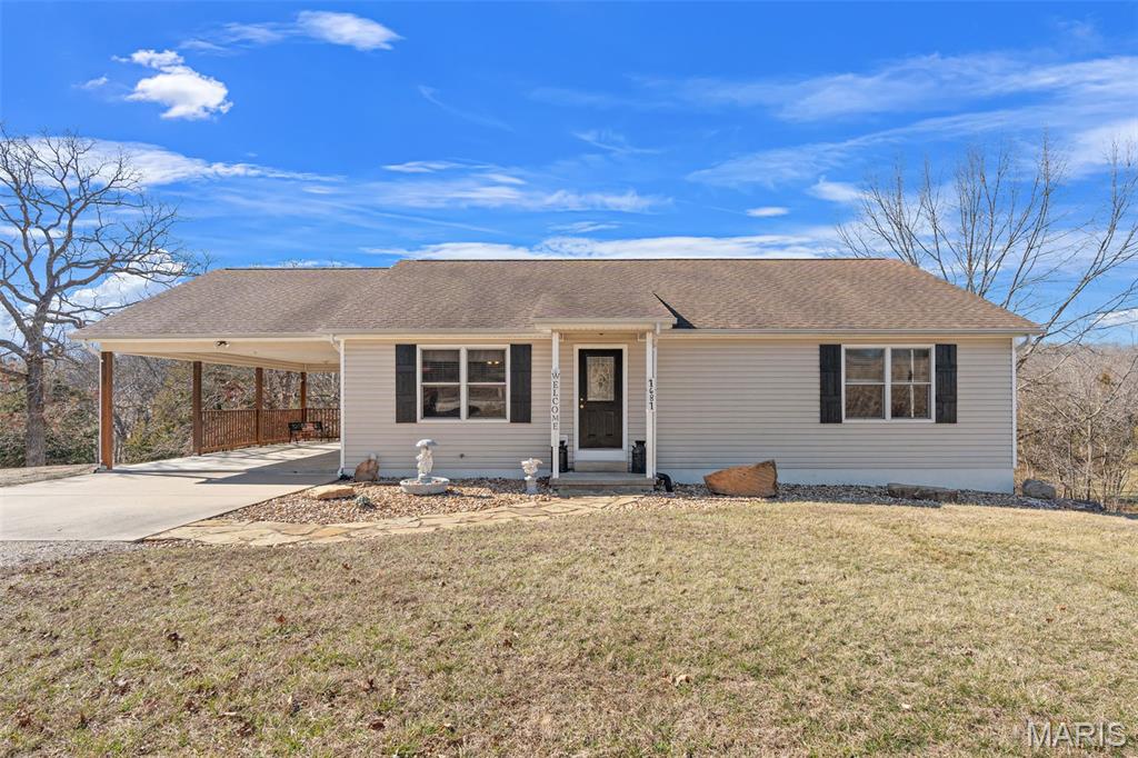 Charming Country Home on 5+ Unrestricted Acres Between New Haven & Hermann!  Immaculately cared-for, one-owner home! This beautiful 1,400 sq. ft. residence offers peaceful country living with thoughtful details throughout. Step inside to find vaulted ceilings, sun-filled skylights, and a cozy gas fireplace that make the open living space feel both warm and spacious. The main-floor laundry room (complete with a handy slop sink) adds everyday convenience. Enjoy the outdoors year-round on your covered, screened-in deck overlooking your beautifully laid land that backs to mature trees and a picturesque wet-weather creek. Each bedroom includes walk-in closets, and the walk-out basement is already framed for your vision, perfect for a future 3rd bedroom or family room expansion. Outside, a 12x24 shed provides extra storage space for your tools, toys, or hobby projects. With 5+ unrestricted acres, the possibilities are endless, bring your animals, build a shop, or simply enjoy the tranquility of country living. This property is a rare find, it's clean, cared for, and ready for its next chapter. Come fall in love with the country setting and the pride of ownership that shines through every inch!