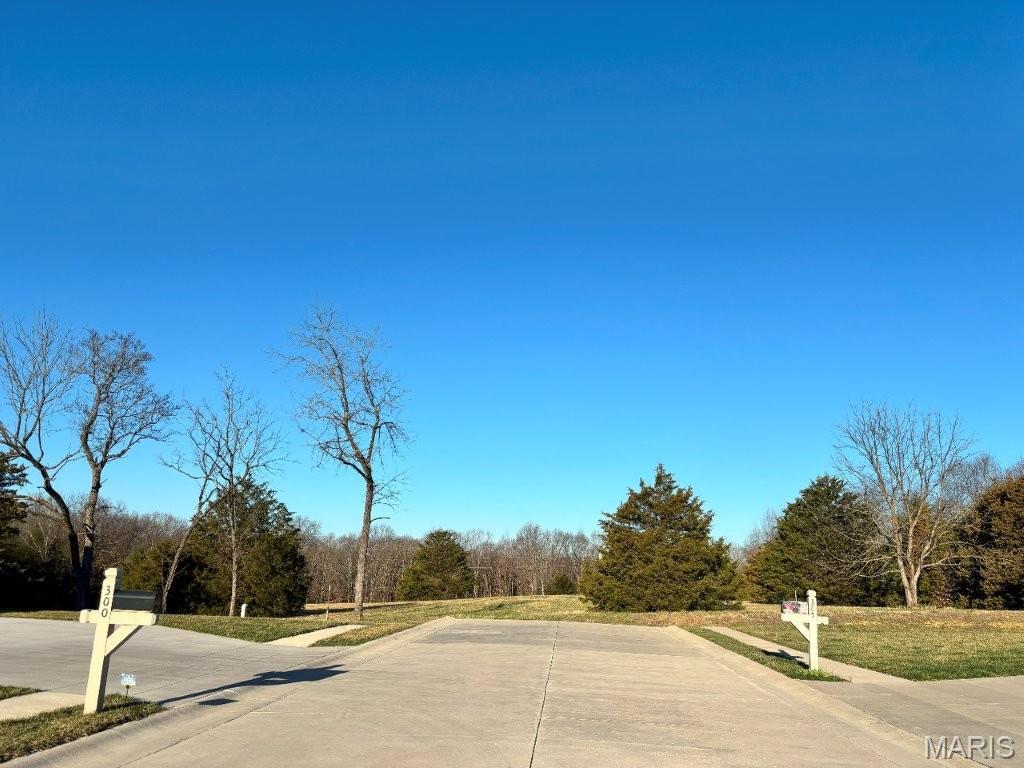 Beautiful wooded and open oasis less than one mile from Hwy 54.  Property would be great for building, hunting or recreation. Property borders Holt Summit City Limits and Greenway Park with hiking trails and a lake. Property has marketable timber, cedar groves, wet weather creek and beautiful meadows.  Excellent hunting and great for building your own custom home with a great lake site.  Close to Hwy 54 and just 7 miles north of Jefferson City. Water and sewer available.
