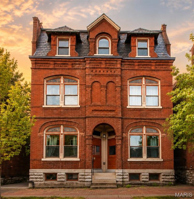 100% LEASED | FULLY FURNISHED | HISTORIC SOULARD. A turnkey 3-unit income package - 926 Allen Avenue, the historic brick rowhouse - offered individually at $635,000. Gut-renovated in 2018 (new HVAC, electric, plumbing and roof). Unit mix: one 2BR/1BA at $2,000/mo plus two furnished 1BR/1BA at $1,950/mo each - $5,900/mo, $70,800/yr scheduled. This property HAS OFF STREET PARKING in the rear (extremely rare for Soulard). The furnished units are leased to traveling nurses and corporate professionals whose rent is paid by employer housing stipends: premium rents with a zero-collection-loss track record. Every home delivers in-unit laundry, updated kitchens, hardwood floors, central air and private decks/patio, plus off-street parking and basement storage. THE UPSIDE: SSM Health SLU and BJC/Barnes-Jewish hospitals are minutes away (endless travel-nurse demand), and Soulard has virtually NO hotels - so these turnkey furnished units can flip to short-term/Airbnb on day one (seller has never operated STR). Walk to McGurk's, Molly's, the Farmers Market and the Anheuser-Busch Brewery in St. Louis's most walkable, Mardi Gras-famous neighborhood. Also available as part of the full 922-926 Allen 7-unit package.