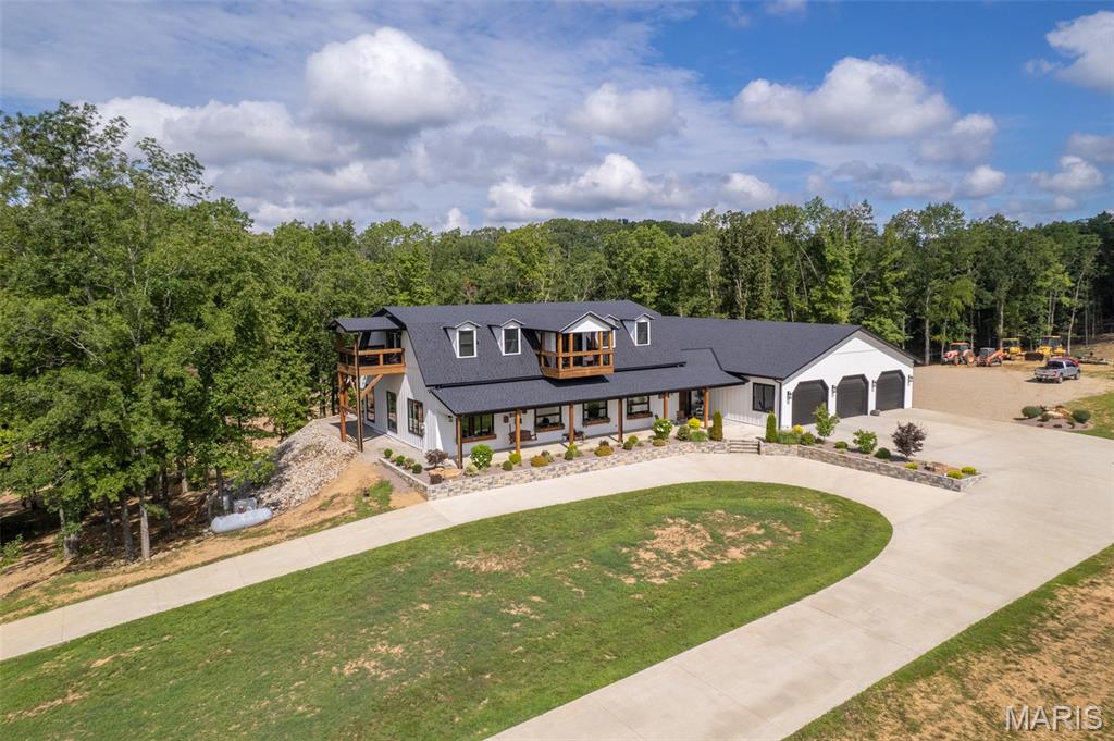 835 Monday Lane is an absolute stunning property.  This home has 4520 SF of living space and a 3500 SF attached garage/workshop for a total of over 8000 SF under roof.  This magnificent home was built by Integrity Design, one of the premier, custom home builders in the area.  Featuring 5 bedrooms and 4.5 baths,  high ceilings, high end finishes and the best location in Butler County make this a must see if you are in the market for not just a home but an Estate to build your family's legacy.  Opportunities to purchase this kind of property don't come along very often.  The craftsmanship and attention to detail that went into building this home are second to none.  This home is being offered with 10+/- acres of picturesque land.  Buyer will also have the choice of purchasing the home with 150 +/- acres.  Seller will provide survey depending on acreage agreed upon.  The maintenance free exterior, Generac, whole home generator, long, paved driveway, circle drive, massive, concrete parking area, covered front porch, covered back patio and really cool twin balconies put this home "over the top".  The living space is very impressive and then you walk into the garage and just go "WOW".  Schedule your appointment for a personal tour today.  It could change your life in a very positive way!