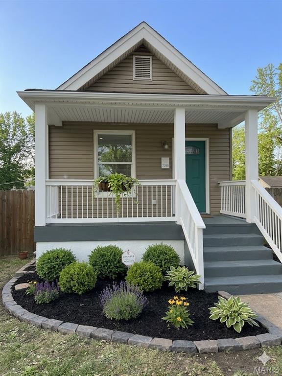 Talk about perfection! This delightful bungalow offers a perfect blend of charm and modern comfort. Featuring 2 bedrooms with fresh paint gorgeous real hardwood floors, generous closet space, and pouring with natural light. The exterior is low maintenance with an adorable covered front porch. Don't forget a privacy fence and LARGE BACK YARD! This perfectly flowing floorpan offers a charming living room, a sunny dining space all blend perfectly to the incredible modern kitchen, a freshly painted and clean basement. This style of home is perfect for first-time buyers, down-sizers, or anyone who loves vintage architecture with just the right amount of modern updates. It’s cozy, cute, and full of character! DON'T MISS IT! Please note the landscaping photos were AI generated to give a buyer potential ideas.